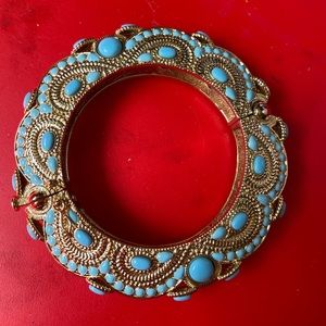Golden bracelet with blue beads